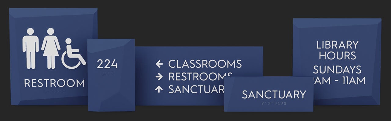 Restroom, room number, directional, common room, and informational Facets signs lined up in a row.